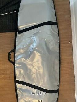 Surfboard travel bag Dakine. Used on just one trip